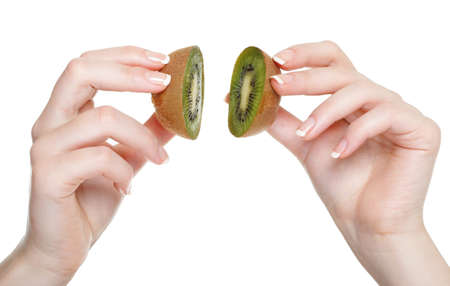 woman hand with kiwi fruit isolated on whiteの写真素材