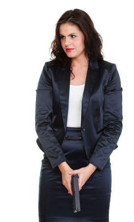 Young brunette woman with gun isolated on whiteの写真素材