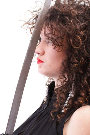 Girl - woman dark curly hair natural brown-haired holding hands katana swordの写真素材