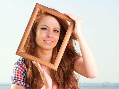 Woman sea sky vacation Holding Frame travel conceptの写真素材