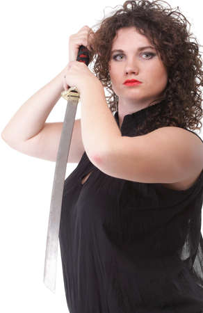 Girl - woman dark curly hair natural brown-haired holding hands katana swordの写真素材