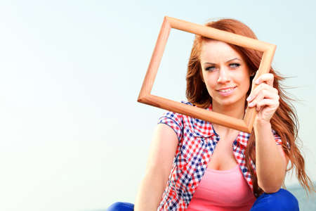 Woman sea sky vacation Holding Frame travel conceptの写真素材