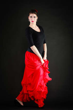 Art  Full length of sexy spanish girl attractive woman in red long skirt dancing flamenco traditional dance の写真素材