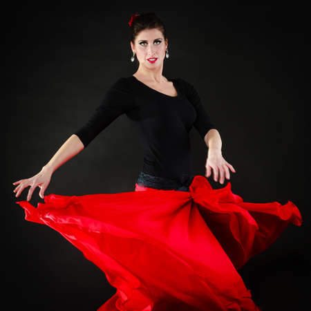 Art. Sexy spanish girl attractive woman in red long skirt dancing flamenco traditional dance.の写真素材