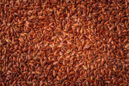 Healthy diet organic nutrition. Brown raw flax seeds linseed as natural food backgroundの写真素材