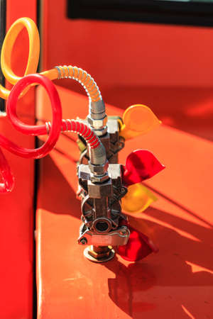 Closeup red yellow air connections hoses of machinery industrial detailの写真素材
