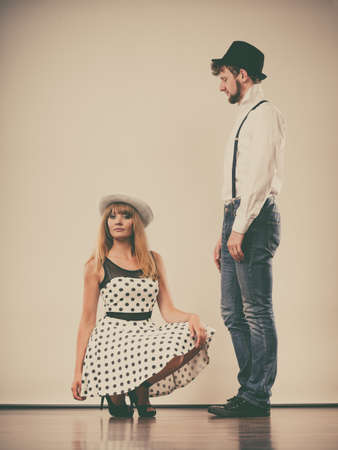 Young retro couple in love handsome man attractive woman portrait studio shot 
の写真素材
