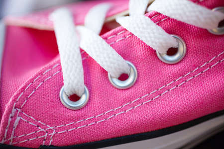 Sport fashion. Closeup pink fashionable sneakers on shop shelfの写真素材