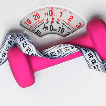 healthy lifestyle fitness weight control concept. Closeup pink dumbbell with measuring tape on white scalesの写真素材