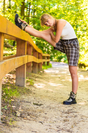 Adventure, tourism, active lifestyle. Hiking young woman in nature preparing for walk hike, girl...
