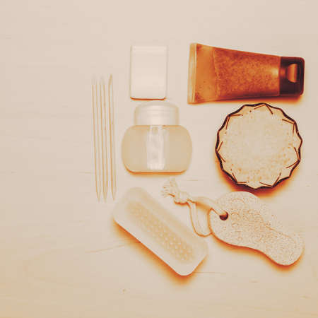Foot care. Pedicure accessories set tools on wooden board background top viewの写真素材