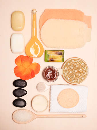 Beauty treatment and body care. Spa products big set of bath room accessories on wooden board top view.の写真素材