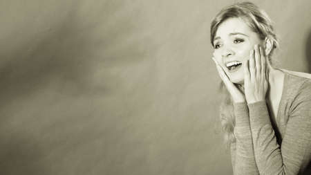 Violence against woman. Scared afraid woman. Negative relations in partnership. Expressive young frightened lady.の写真素材