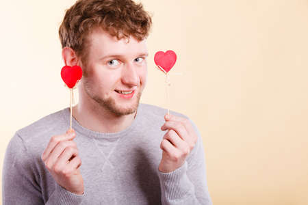 Happy man holding hearts.の写真素材