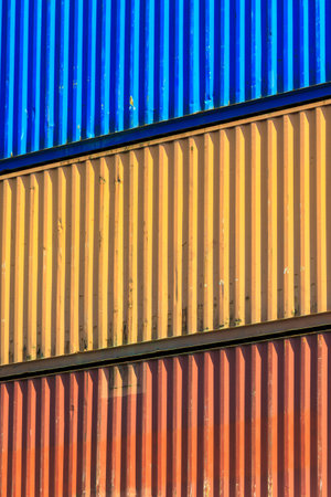 Colorful containers stacked in port.