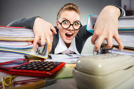 Corporation administration bureau clerk assistant concept. Scary office lady in her kingdom. Obsessed workaholic secretary at desk.の写真素材