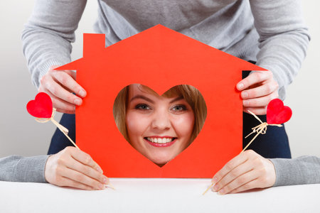 Young smiling couple in love dream plan future in their new house home.の写真素材