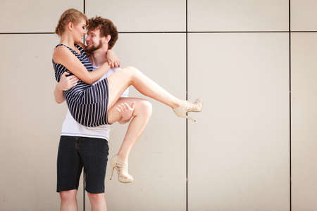 Pretty stunning woman in striped dress and handsome man in white shirt.の写真素材