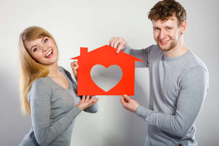 Young smiling couple in love dream plan future in their new house home.の写真素材