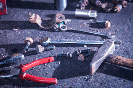 Mechanical automotive fixing engineering industry concept. Pliers, wrench screwdriver on table....