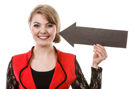 Psychology needs gesture symbol concept. Smiling girl seeking attention. Young lady holding arrow pointer pointing on herself.の写真素材