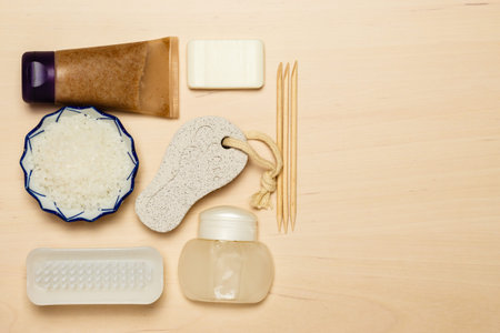 Foot care. Pedicure accessories set tools on wooden board background top view with copy space