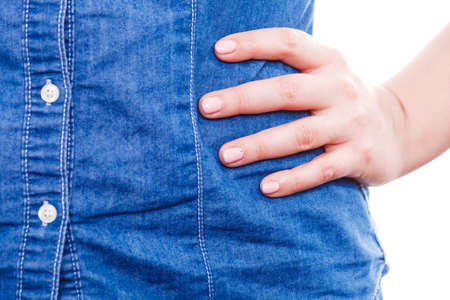 Manicure and hygiene concept. Part body woman presents hand fingers. Girl with one hand coloured by hybrid gel acrylic nail polish varnish.の写真素材