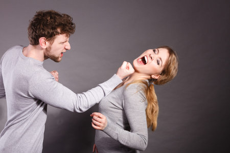 Violence against woman. Aggressive man yelling shouting on scared afraid woman. Negative relations...