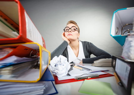 Paperwork job corporation lazy slow boring concept. Bored office employee at work. Female nerdy...