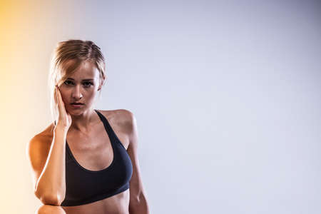 Sport, training, gym and lifestyle concept. Woman in sporstwear black bra doing fitness exercisesの写真素材