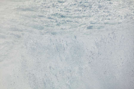 Blue white ocean water wave foam abstract backgroundの写真素材