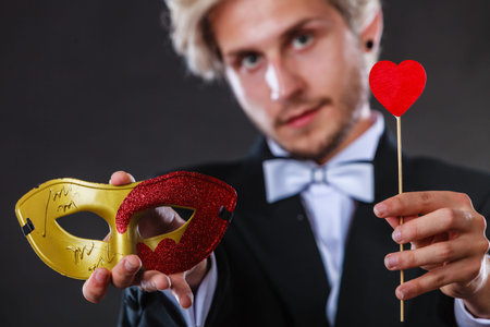 Valentines day. Love concept. Holidays and celebration. Elegant young guy wearing suit white shirt...