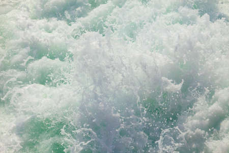 Blue white ocean water wave foam abstract backgroundの写真素材