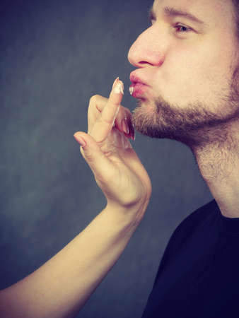 Beauty moisture care health concept. Man gets cream on his face. Young male with skin care.の写真素材