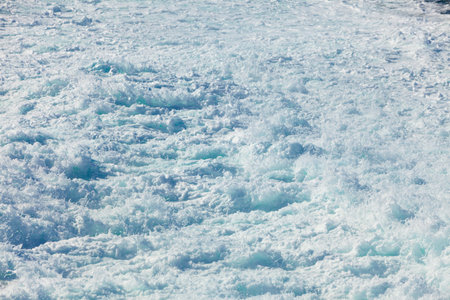 Blue white ocean water wave foam abstract backgroundの写真素材