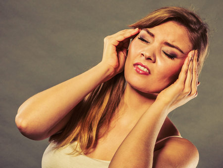 Health problem, stress and depression. Woman suffering from headache migraine pain. Stressed female...