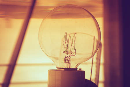 Closeup inside of old lighthouse showing the light bulb interior.の写真素材