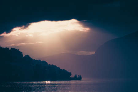 Tourism vacation and travel. Red sunset over fjords mountains landscape, Sogn og Fjordane county, Norway Scandinavia Europe. Beautiful natureの写真素材