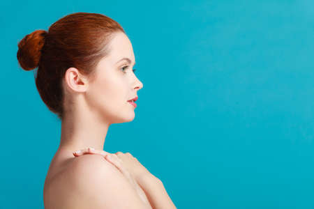 Beauty female body. Attractive sensual woman red hair with nacked shoulders. Pertect clean soft skinの写真素材