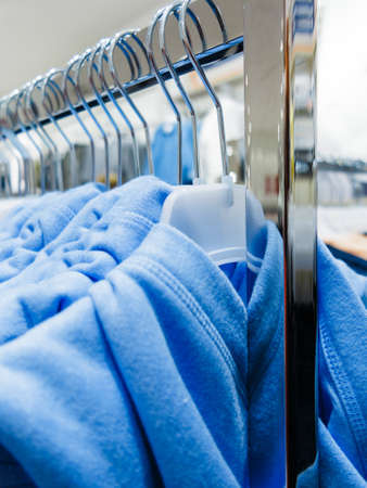 Shopping time concept. Garment fashion clothes in botique shop market. New collection hanging in store supermarket.の写真素材