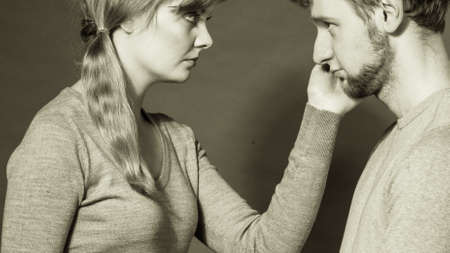 Depression and sadness concept. Unhappy depressed couple after argument. Sad woman and disappointed man standing together.の写真素材