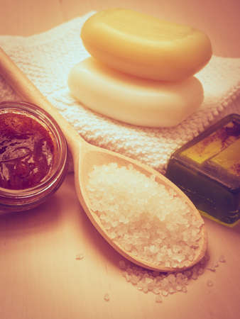Beauty treatment therapy and skin care. Closeup spa products some bath accessories on wooden table.の写真素材