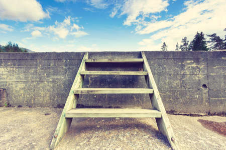 Wooden ladder on wall outdoor, travel tourism or business competition conceptの写真素材