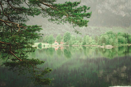 Norwegian country house in the mountains. Beautiful coastline fjords landscape in Norway, Scandinavia Europeの写真素材