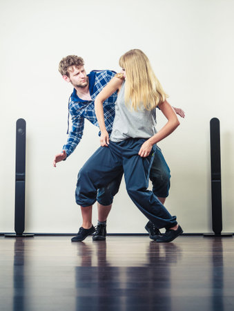 Two modern dancers couple woman and man dancing. Urban lifestyle. Hip-hop generation.