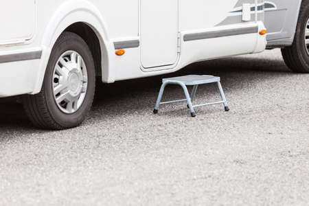 Tourism vacation and travel. Camper van car outdoor, detail of entrance door with small stepの写真素材
