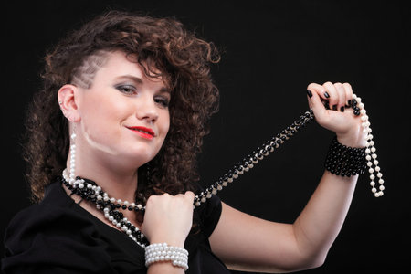 Girl - Ear super piercing woman dark hair natural brown-haired black background