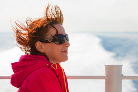 Travel holiday and tourism. Tourist woman on cruise ship boat enjoying open ocean view, seascape...