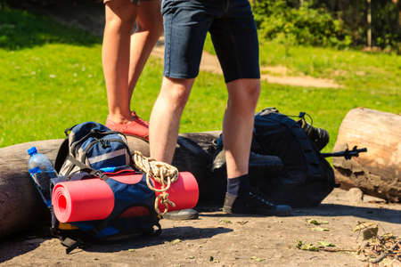 Survival leisure relax holidays nature concept. Couple packed for trip. Young girl and boy taking baggage for outdoor hiking.の写真素材