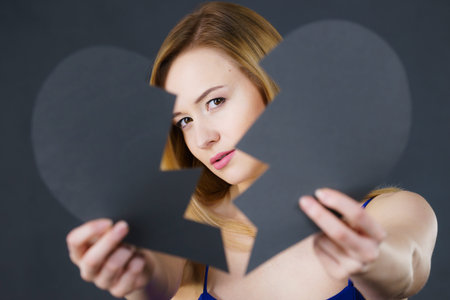 Depression, sadness, relationship problem concept. Young female with broken heart full of negative...